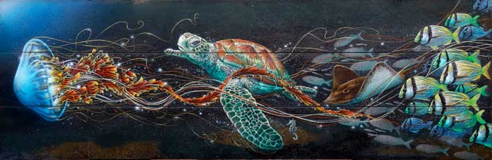 Jellyfish with loggerhead sea turtle and fish school
